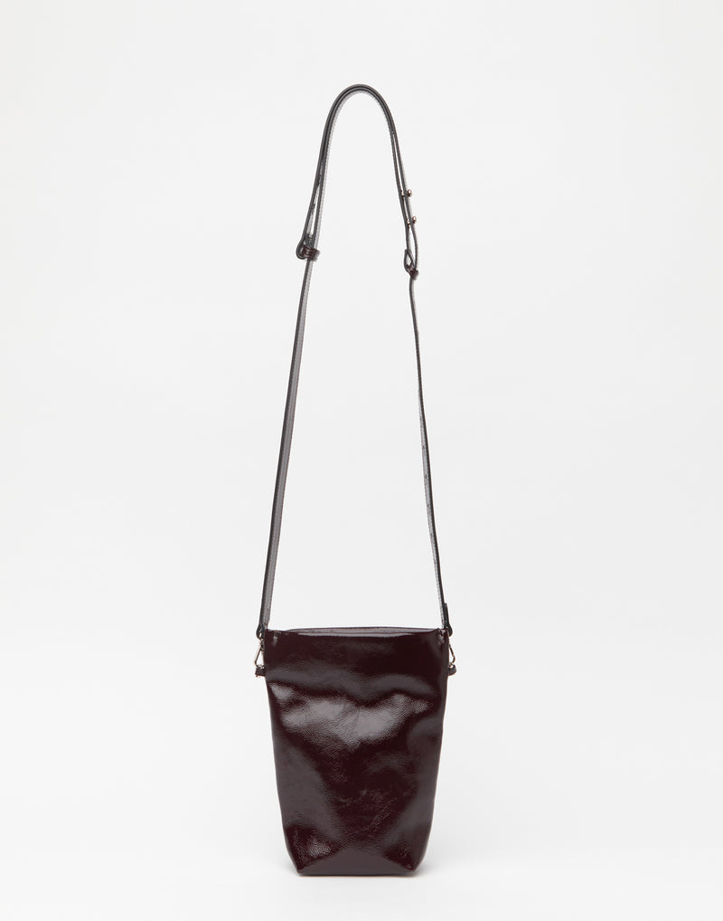 zilla-cacao-patent-leather-cross-body-belt-bucket-bag.jpeg